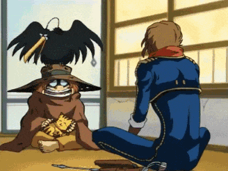 a man in a blue suit sits on the floor next to a cat and a bird