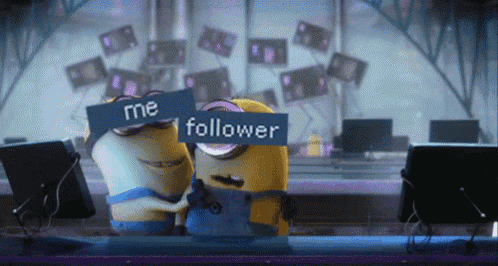 two minions are hugging and one has a sign that says me follower on it