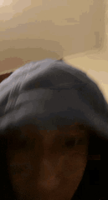 a blurry picture of a person wearing a hood