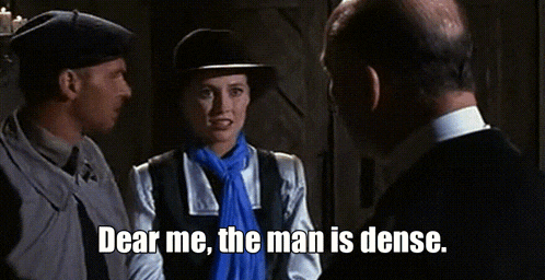 a man and a woman are standing next to each other and the man is dense