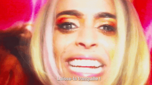 a close up of a woman 's face with the words laisse-la tranquille written below her