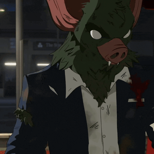 a man wearing a bat mask is eating a sandwich