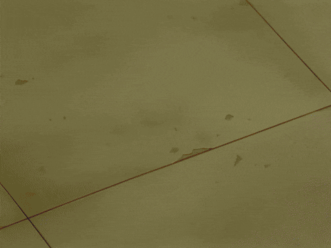 a bright yellow light is coming out of a hole in the floor
