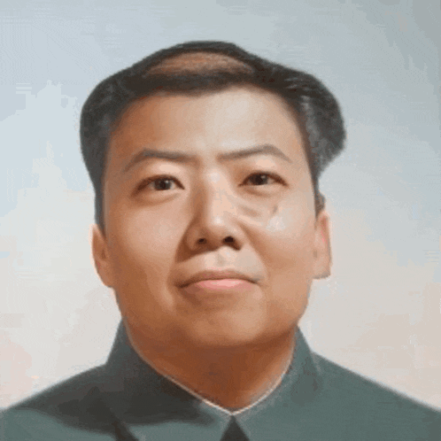 a close up of a man 's face with a very bald head