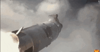 a missile is being launched into the sky .