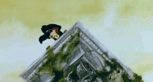 a cartoon character is sitting on top of a building .