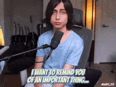 a young man sitting in front of a microphone with the words i want to remind you of an important thing