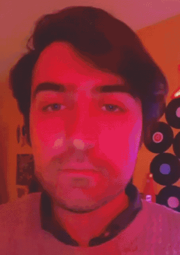 a pixelated image of a man 's face with a green background