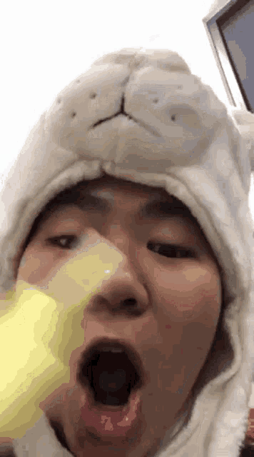 a person wearing a white hat with a bunny face on it