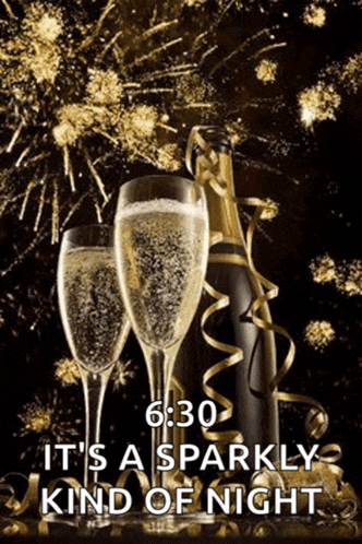 two glasses of champagne and a bottle of champagne with fireworks behind them