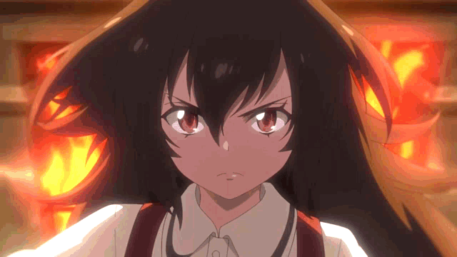 a close up of a girl 's face with fire behind her