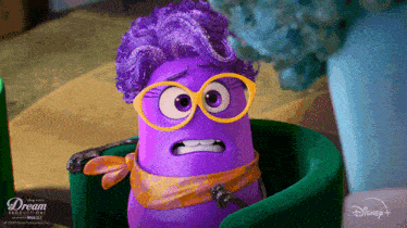 a purple cartoon character wearing glasses and a scarf is from the dream productions