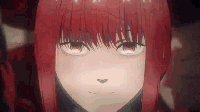 a close up of a red haired anime girl with a heart shaped nose .