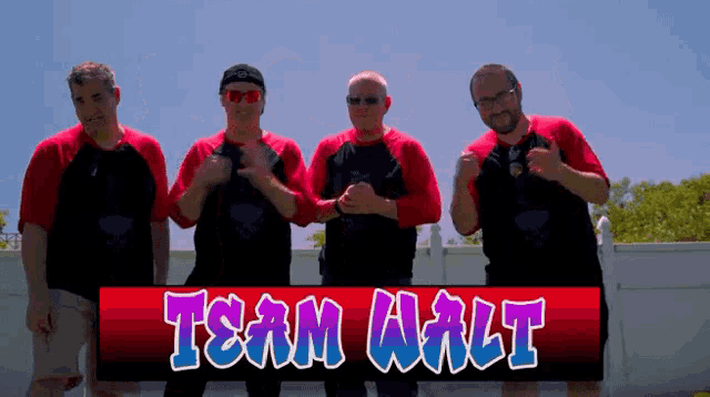 a group of men standing next to a sign that says team walt