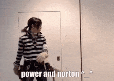 a man in a striped shirt is standing in front of a door with the words " power and norton " written below him