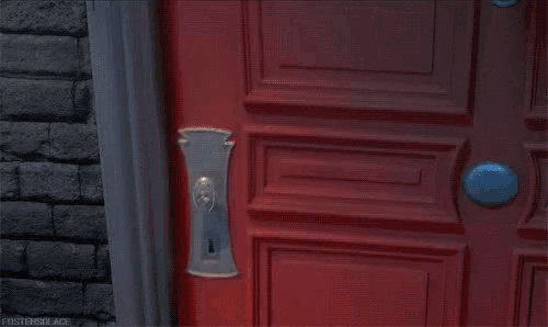 a yellow minion wearing a maid costume is standing in a red doorway .