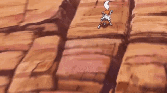 a cartoon fox is walking across a rocky surface .