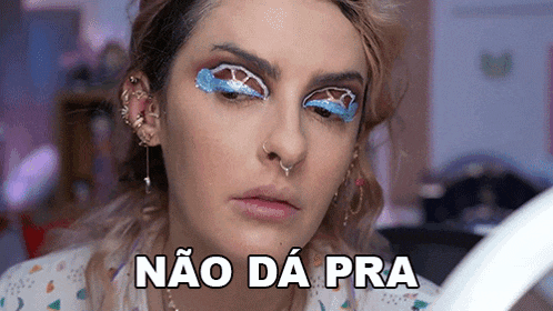 a woman with makeup on her face is holding a piece of paper and says não da pra