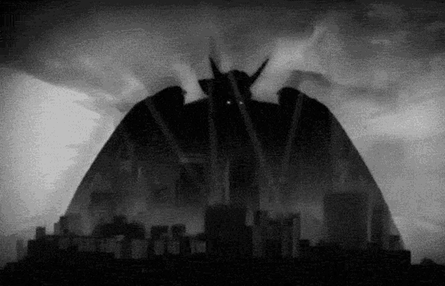 a black and white drawing of a monster with horns