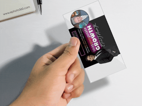 a hand holding a business card that says inappropriate growth on it