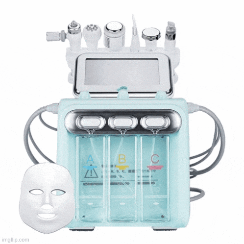 a face mask is sitting next to a machine that says abc on it
