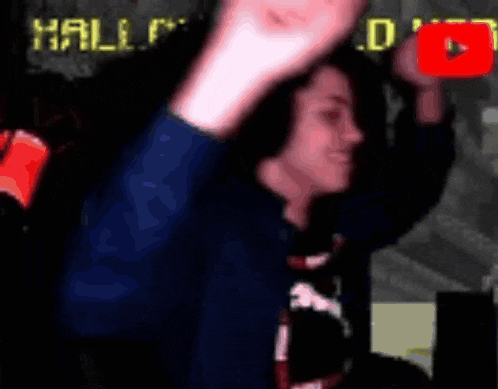 a person is waving in front of a sign that says hallowe 's bed