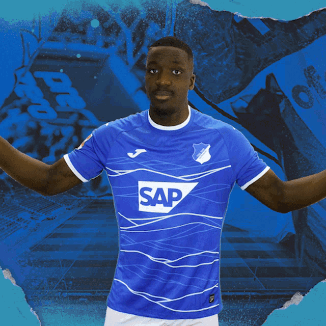 a man wearing a blue shirt with the word sap on the front