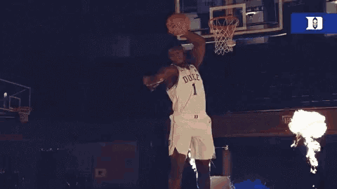 a duke basketball player is surrounded by flames