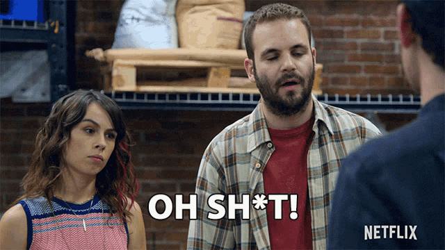 a man in a plaid shirt says " oh sh * t " while standing next to a woman