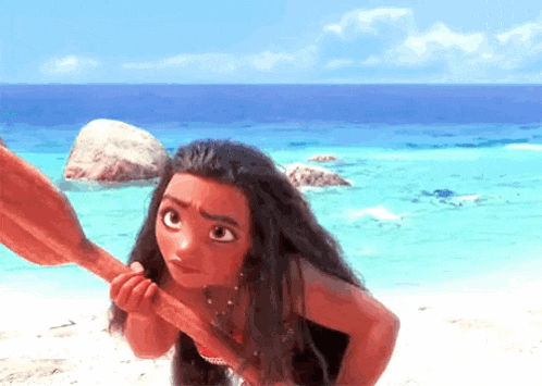 moana from the movie moana is holding a stick on the beach .