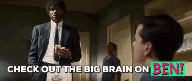 a man in a suit and tie is holding a bag that says check out the big brain on ben !