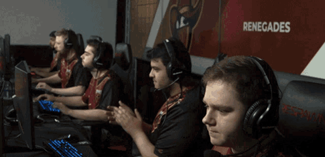 a group of renegades players are sitting in front of their computers