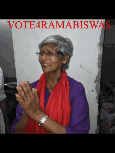 a woman wearing glasses and a red scarf with the words vote4ramabiswas on the top
