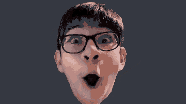 a close up of a person 's face with glasses and a surprised expression