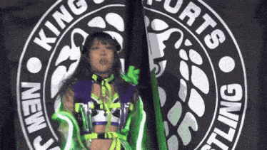 a woman is standing in front of a logo that says king sports