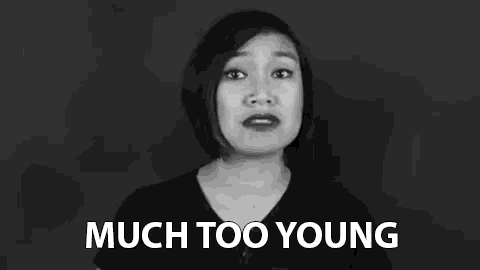 a woman is making a funny face in a black and white photo .