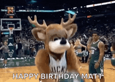 a mascot is standing on a basketball court .