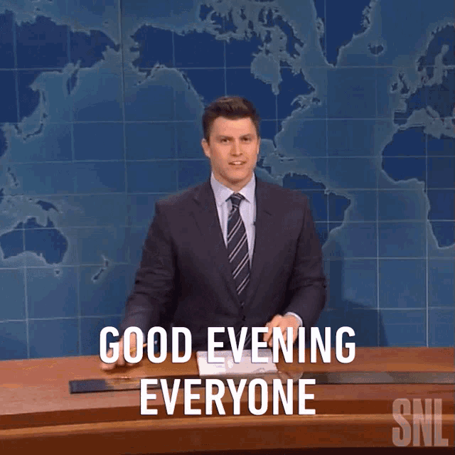 a man in a suit and tie says good evening everyone on snl