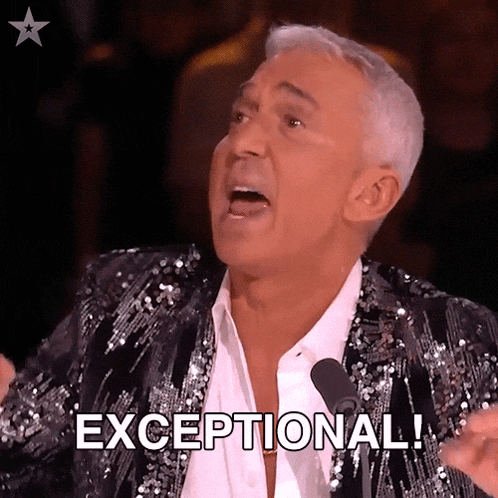 a man in a sequined jacket is saying exceptional in front of a microphone