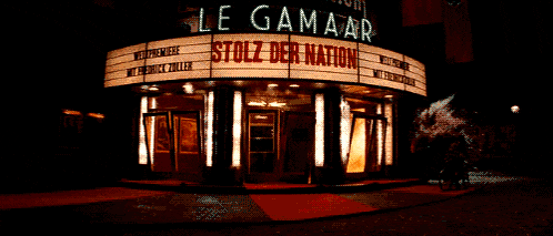 a movie theater with a sign that says ' stolz der nation ' on it