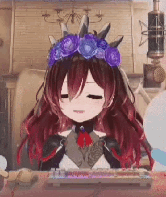a girl with long red hair is wearing a crown of flowers and sitting at a desk .