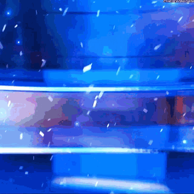 a blue background with a watermark that says the next time on it