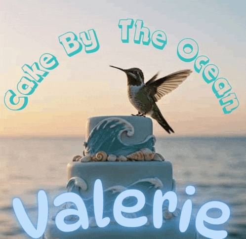 a cake by the ocean logo with a hummingbird on top of it