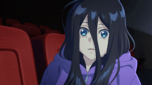 a girl with long black hair is wearing a purple sweatshirt