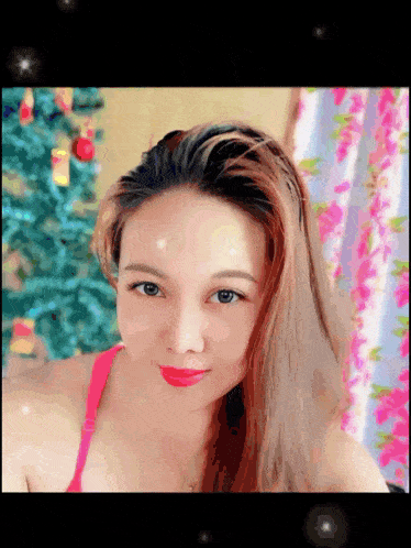 a painting of a woman with a christmas tree behind her