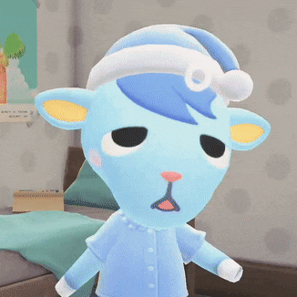 a blue stuffed animal wearing a pajama top and hat