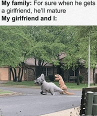 a couple of dinosaurs walking down a street next to each other