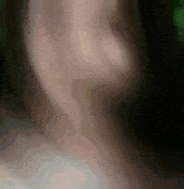 a blurry picture of a person 's face with a dark background