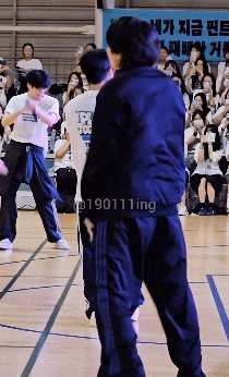 a group of people standing on a basketball court with the number 190111 ing on the bottom