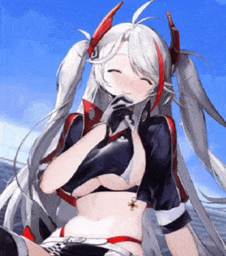 a girl with pigtails is smiling and holding her hand to her mouth